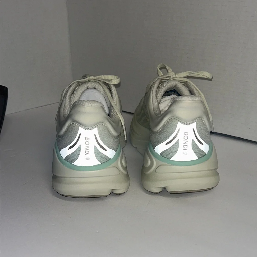 Hoka Off-White and Light Green Athletic Shoes